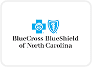 A blue cross and shield logo on top of a white background.